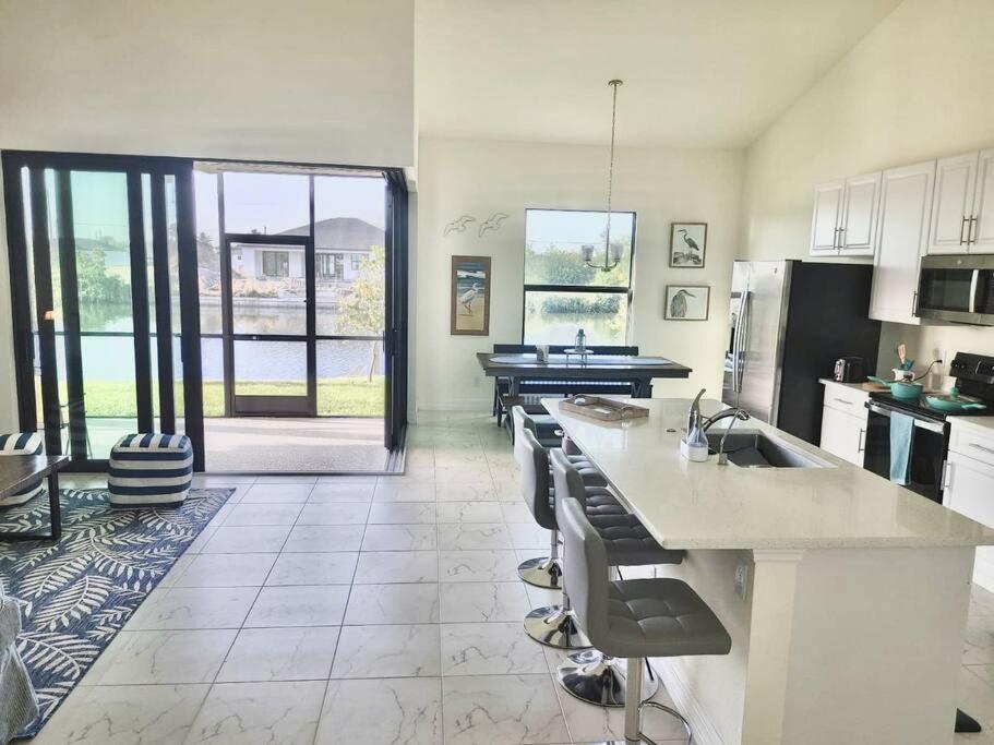 New 4 Bed House On A Canal Facing South & Door Ramp, Near Golf Course And Softball Cape Coral